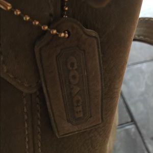 Coach cross body strap mini bucket purse.